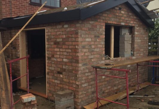 Photo of bricklaying extension in the progress of finishing